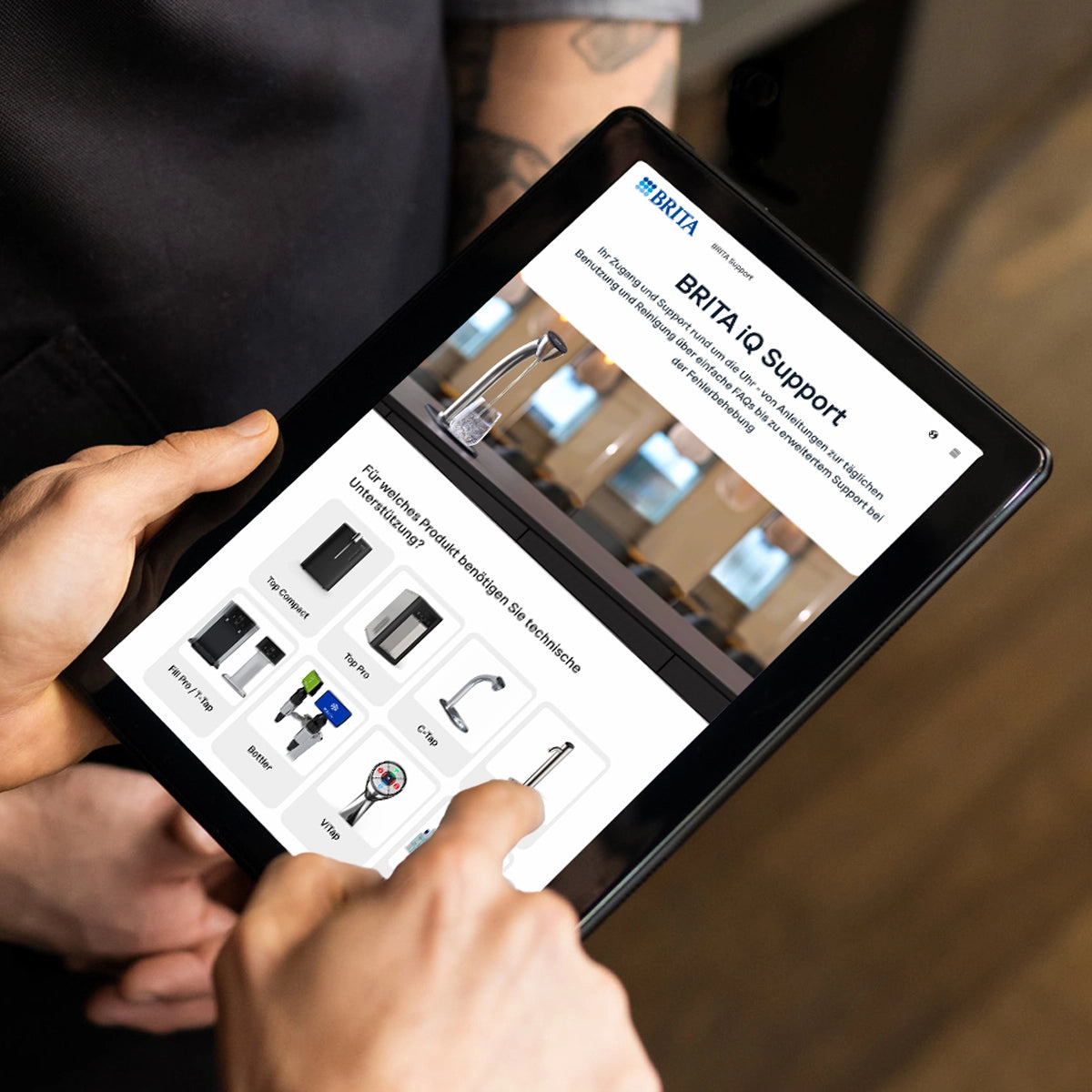 Person using a tablet with the display showing the BRITA IQ Support software