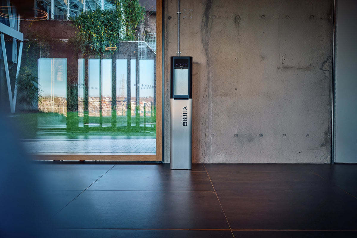 Modern interior with a metallic door and BRITA branded Top Pro water dispenser.